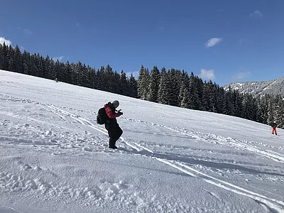 Übergossene Alm - Skifahrer auf der Piste